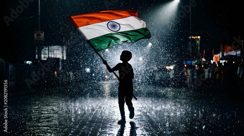 Indian independence day celebration boy waving flag in heavy rain
