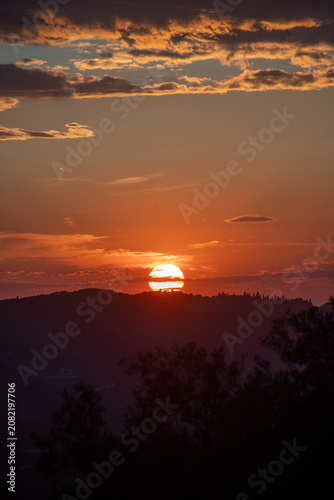 Golden Sunset Over Hills in North Corfu Greece Beautiful Orange Sky and Cloud Silhouette Stock Photo
