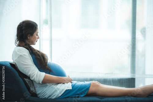 Fotografie Pregnant woman maternity expectant mother pregnancy woman female belly baby bump