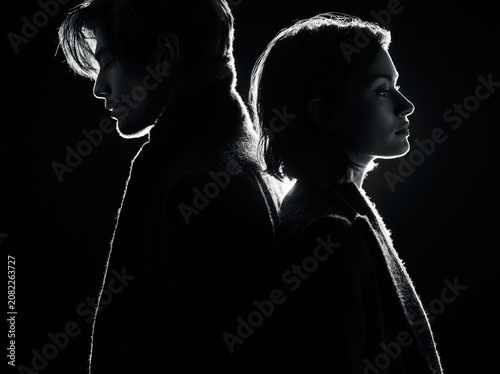 Man and Woman Back to Back in Silhouette