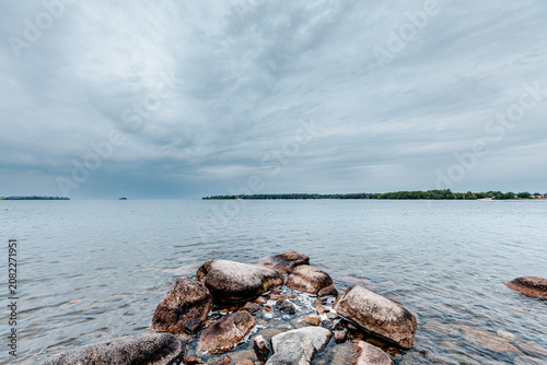 Dramatic sunset with storm clouds over Lake Vattern in Motala, Sweden.
