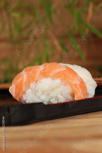fresh sashimi and sushi served with soy sauce and wasabi