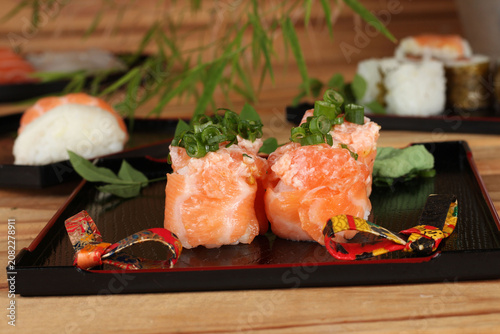fresh sashimi and sushi served with soy sauce and wasabi