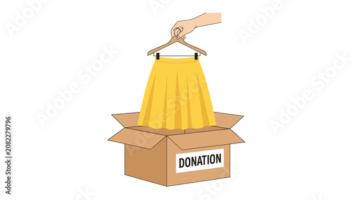 Hand putting a yellow pleated skirt on a clothes hanger into a cardboard donation box on white background.