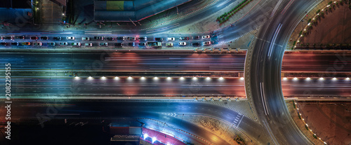 Expressway, Self-driving autonomous electric cars of the future with elements move along a busy traffic intersection. Artificial Intelligence, Car Scan, GPS Tracking, Smart Roads, IoT, highway