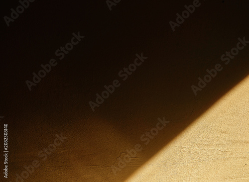 Dramatic reflected light beam on the corner of the room wall abstract