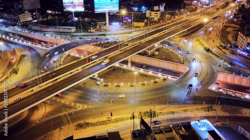 Expressway, Self-driving autonomous electric cars of the future with elements move along a busy traffic intersection. Artificial Intelligence, Car Scan, GPS Tracking, Smart Roads, IoT, highway