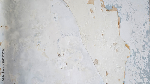 Cuadro en lienzo Peeling paint exposing multiple layers of an old grunge wall, creating a texture