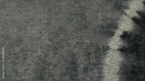 dark gray tie dye fabric background with soft cotton terry cloth texture moving in an organic moody aesthetic