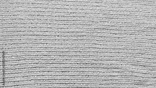 textured white knitted fabric surface filling the cinematic frame with subtle shadows showcasing slow mindful living