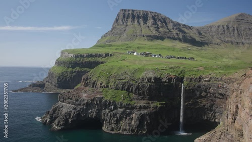Múlafossur Waterfall on sunny day in Faroe Islands
