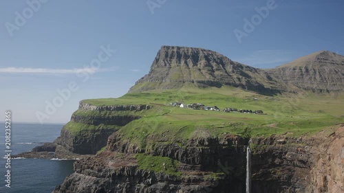 Múlafossur Waterfall on sunny day in Faroe Islands