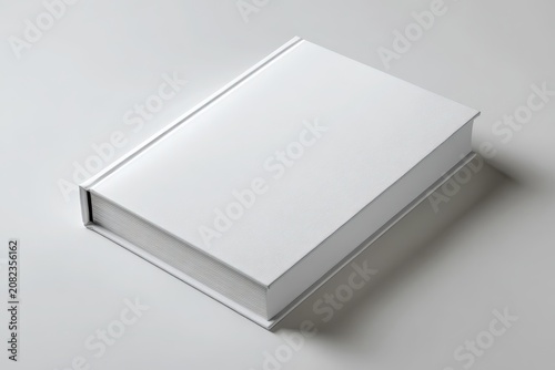 Blank hardcover book on a clean studio desk, simple design for branding and layout mockups