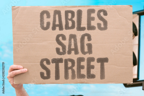Obraz na plátně "Cables sag street" Power lines hang lower than normal