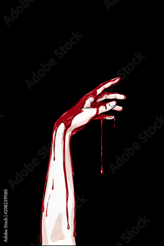 arm reaching up, dripping blood; isolated on black