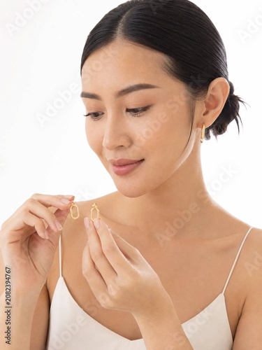 woman applying cream on her face