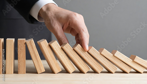 Domino Intervention – Hand Stopping Chain Reaction