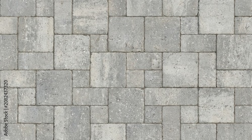 Seamless grey stone paver texture with irregular masonry layout for architectural backgrounds