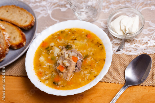 Schilderij op canvas Rassolnik: popular Russian soup with pickled cucumbers, brine and pearl barley