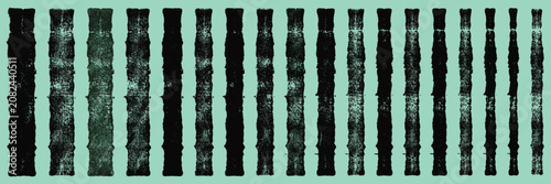 Vászonkép A series of textured black bamboo stalks varying in height and thickness against