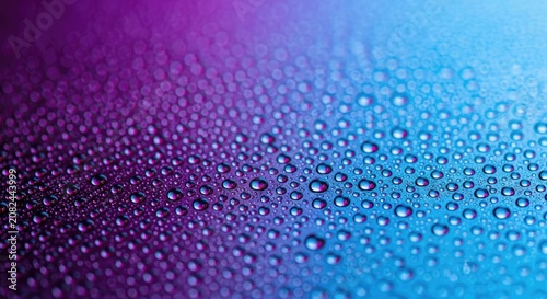 Macro water droplets on purple and blue neon surface