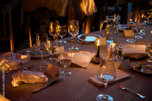 Obraz na płótnie Refined candlelit dining table prepared for elegant wedding reception featuring