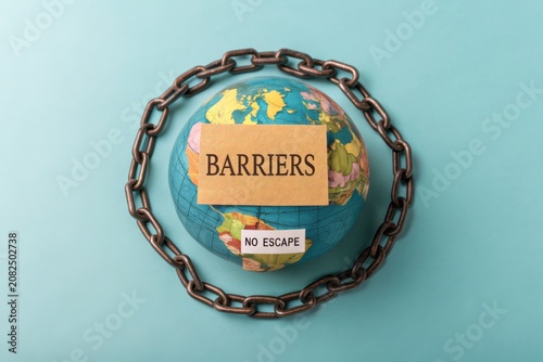 Globe Encased in Chains with 'Barriers' Sign