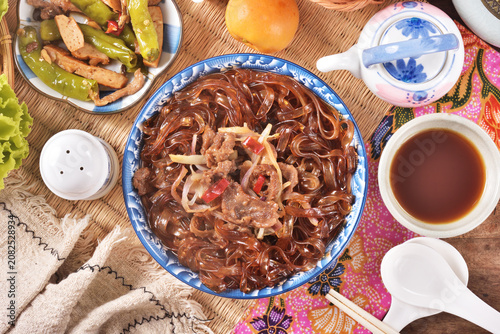 cantonese-styles stir-fried beef wideglass noodles on the plate