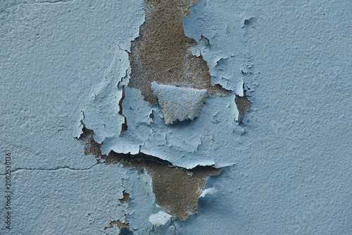 Fotografie The paint is peeling off the concrete wall of the house concrete