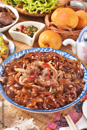 cantonese-styles stir-fried beef wideglass noodles on the plate