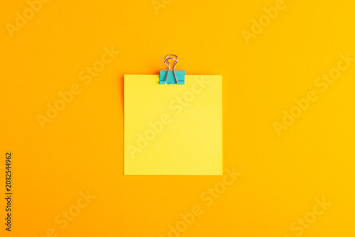 Принти на полотні top view yellow sticker empty on the orange background school copybook notepad c