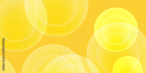 Minimalist yellow abstract pattern with floating transparent round shapes for creative design backdrops.