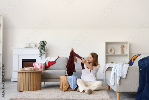 Tired young woman sorting d...