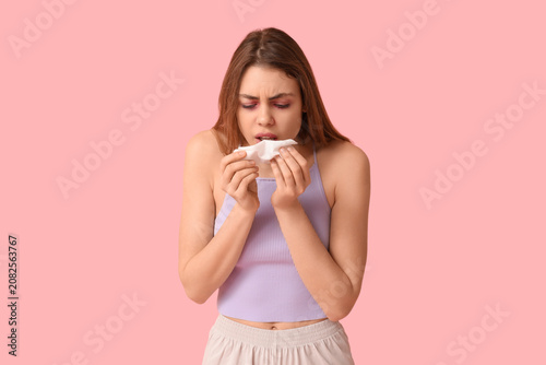 Woman with tissue suffering...