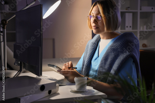 Female nurse with notebook ...