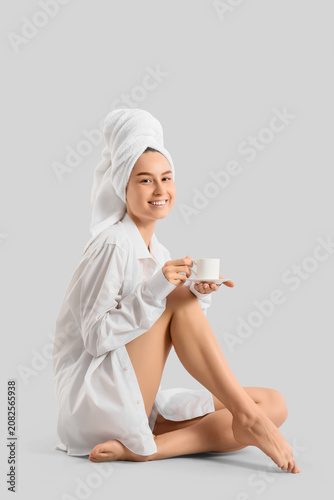 Young woman with towel and ...
