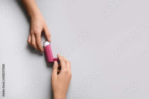 Childs hands with asthma in...