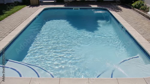 A perfect summer day at the backyard swimming pool