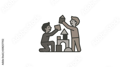 Two Boys Building a Sandcastle Together.