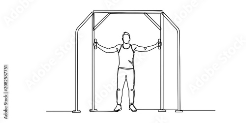 Photos A man exercising using cable crossover machine for chest workout in the gym