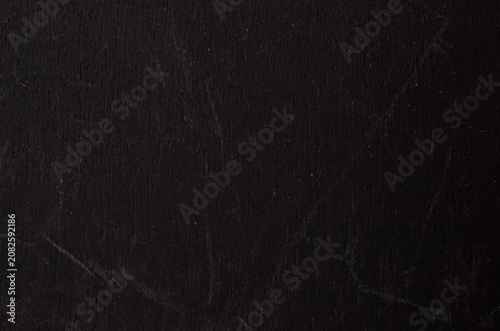 Dark black textured chalkboard background with subtle scratches for moody design
