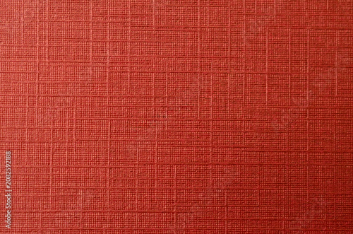 Bright red textured linen paper background for festive greeting card design