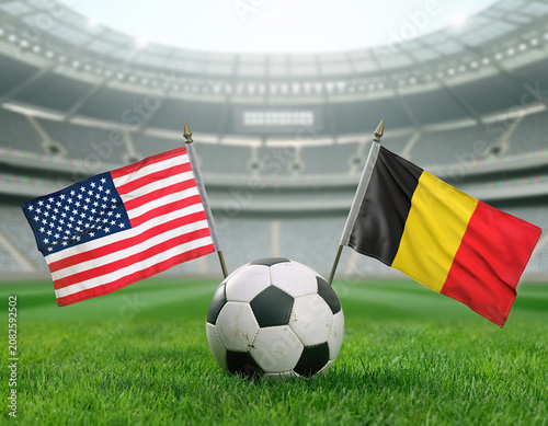 Soccer ball on stadium grass field with united states and belgium flags football competition tournament international championship champion