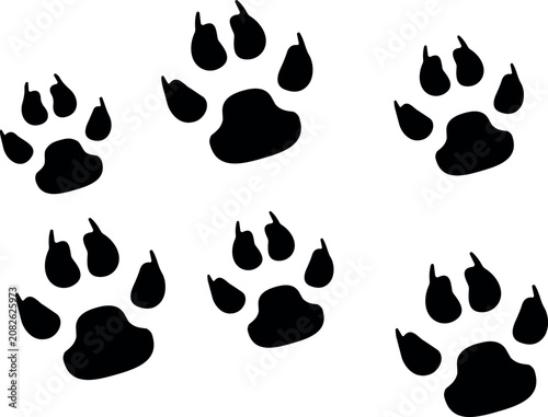 Canvas Print Set of black animal paw prints showing wild cat or dog footprints pattern for cr
