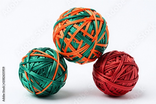 A group of three balls of yarn sitting on top of each other