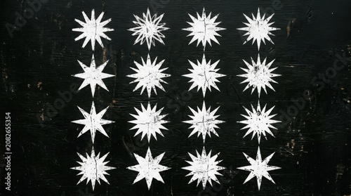 White starbursts on black grunge background