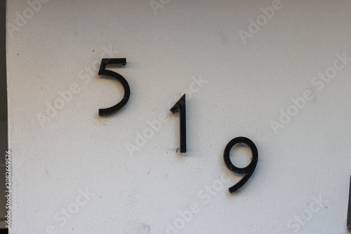 Modern Metal House Number on Exterior Wall