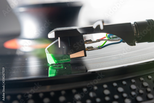Macro Close-Up of Turntable Stylus Playing a Vinyl Record