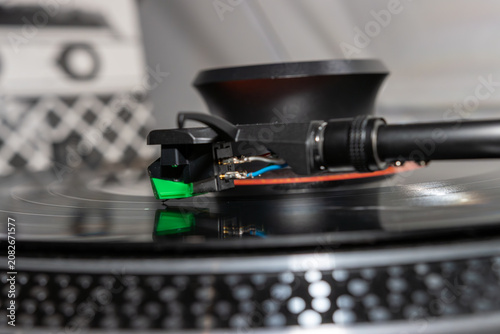 Macro Close-Up of Turntable Stylus Playing a Vinyl Record
