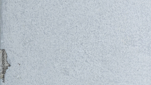 Fotografie Gray textured concrete wall desktop wallpaper with a rough, cracked surface and